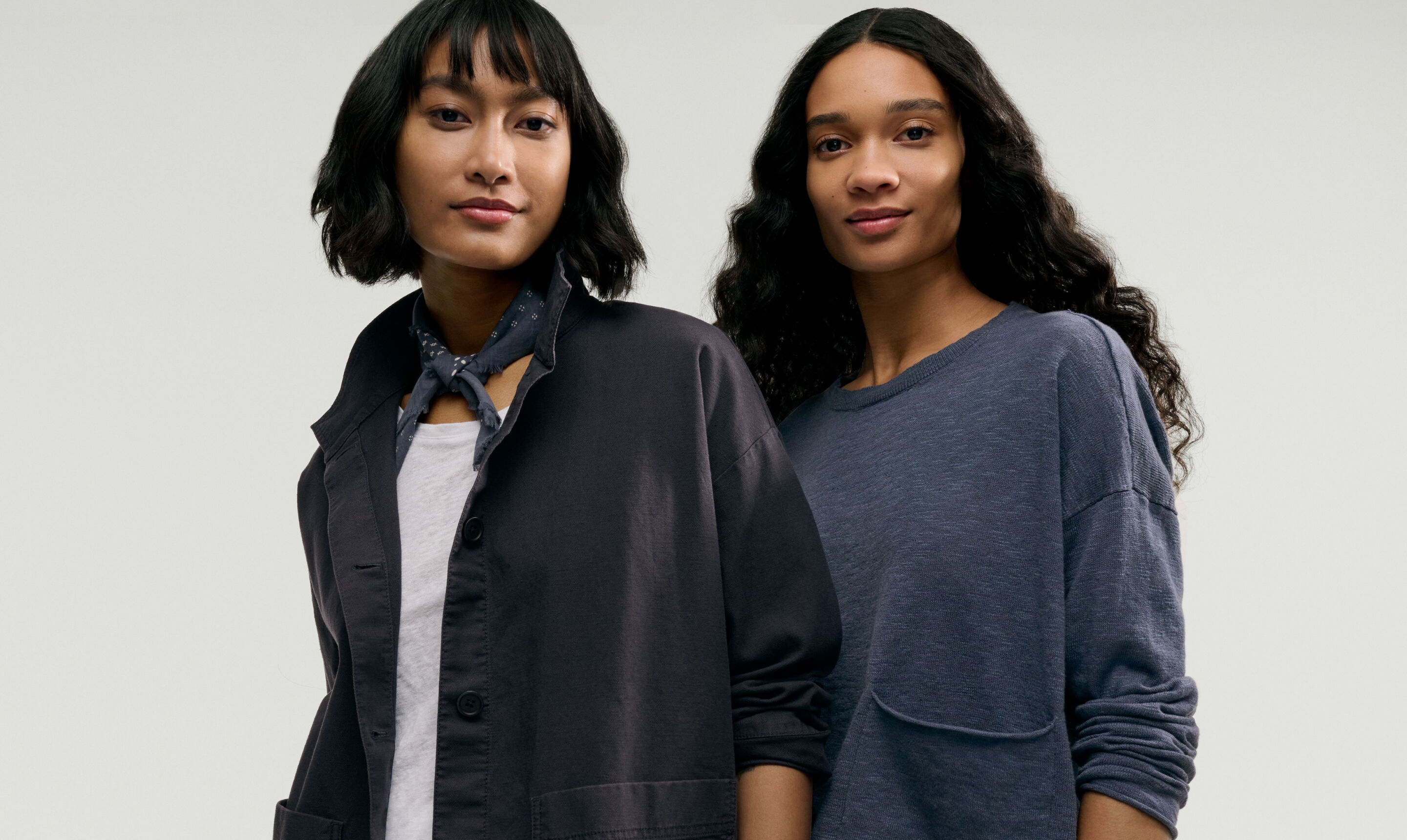 Two women wearing seasonless outfits.