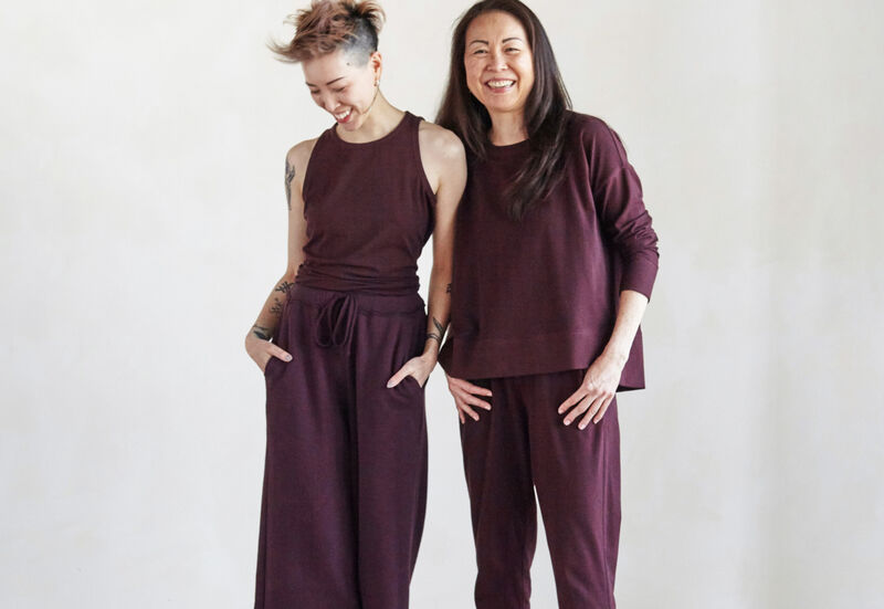 Two women wearing clothing with different proportions.                           