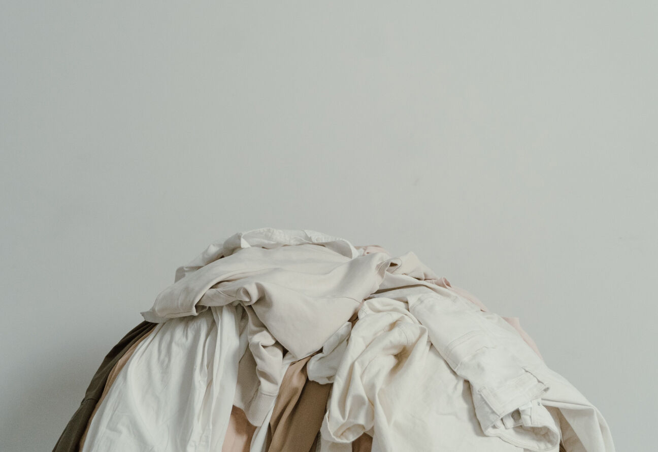 A pile of neutral-colored clothing.