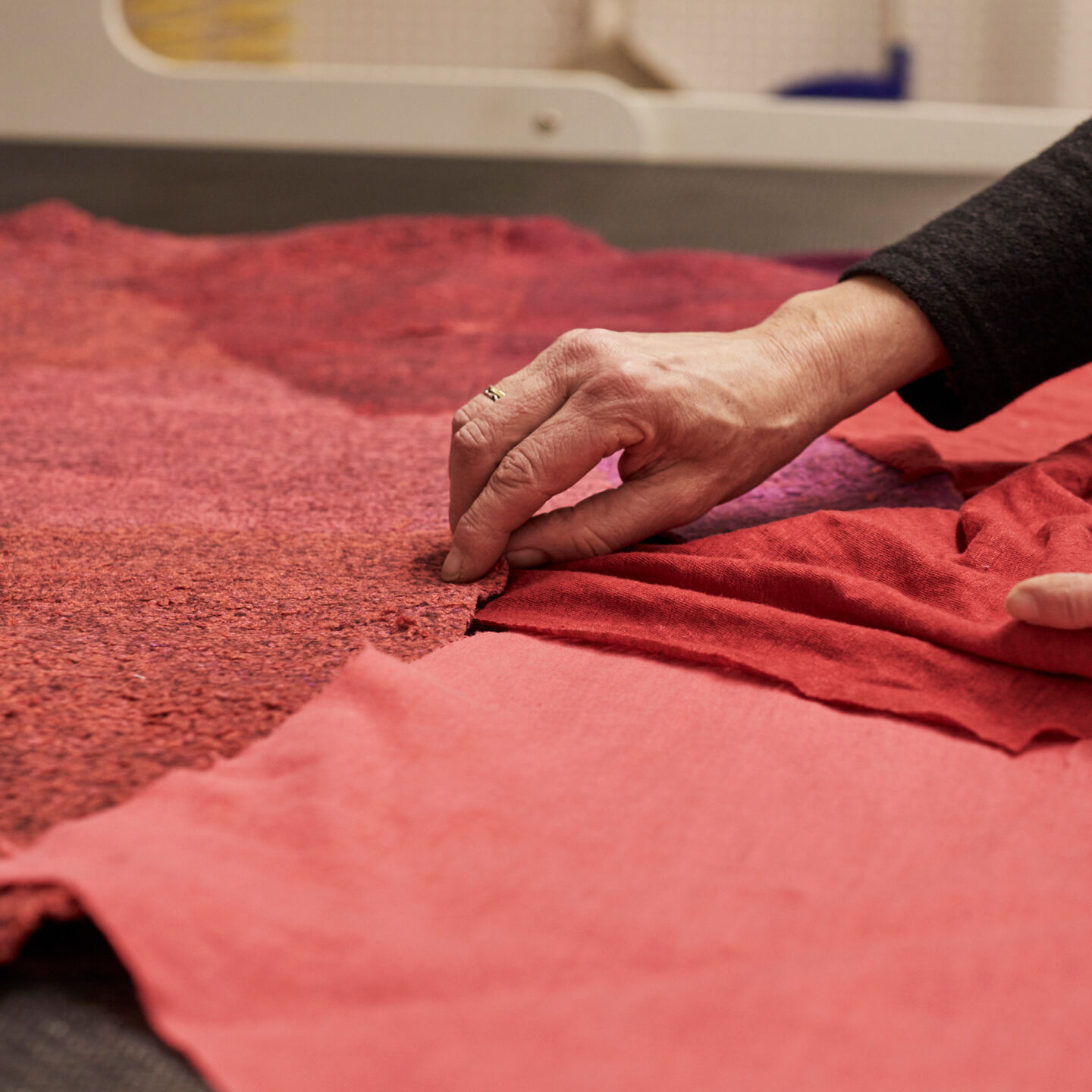 Arranging fabric panels to create an abstract composition. Arranging fabric panels to create an abstract composition.