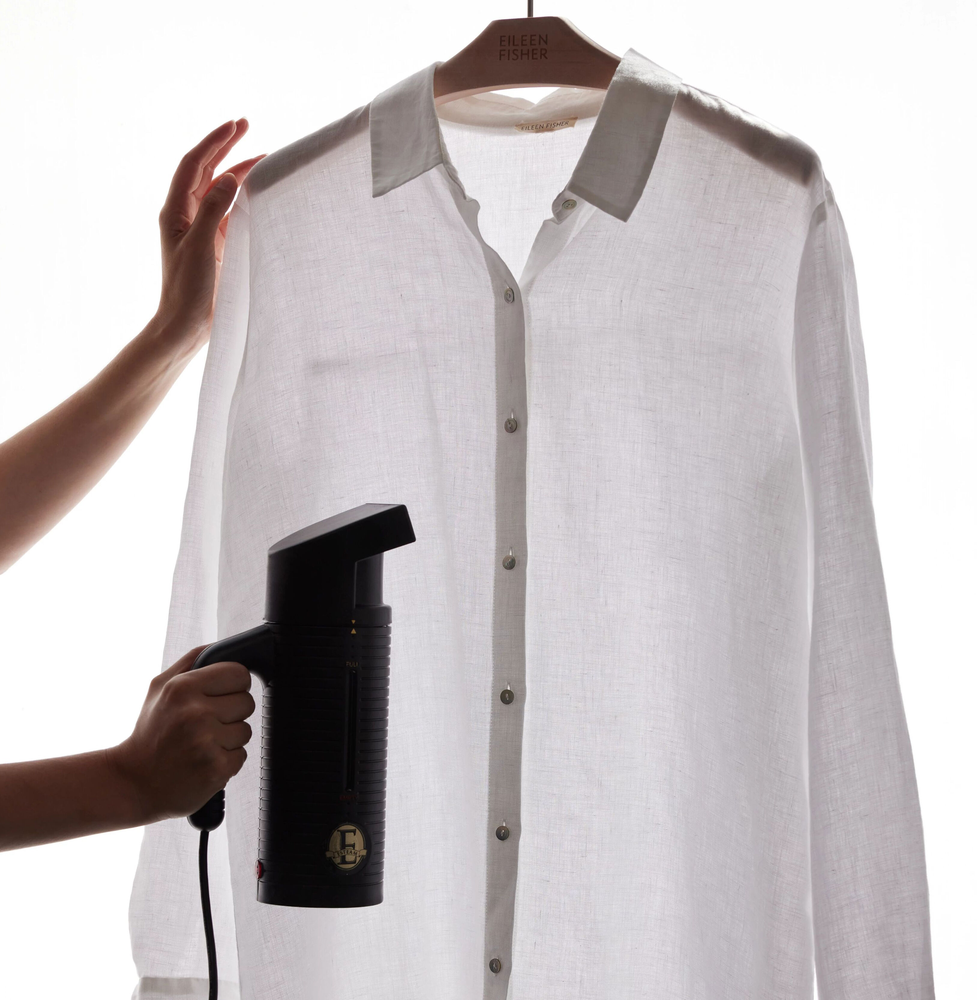 Steaming a white linen shirt.