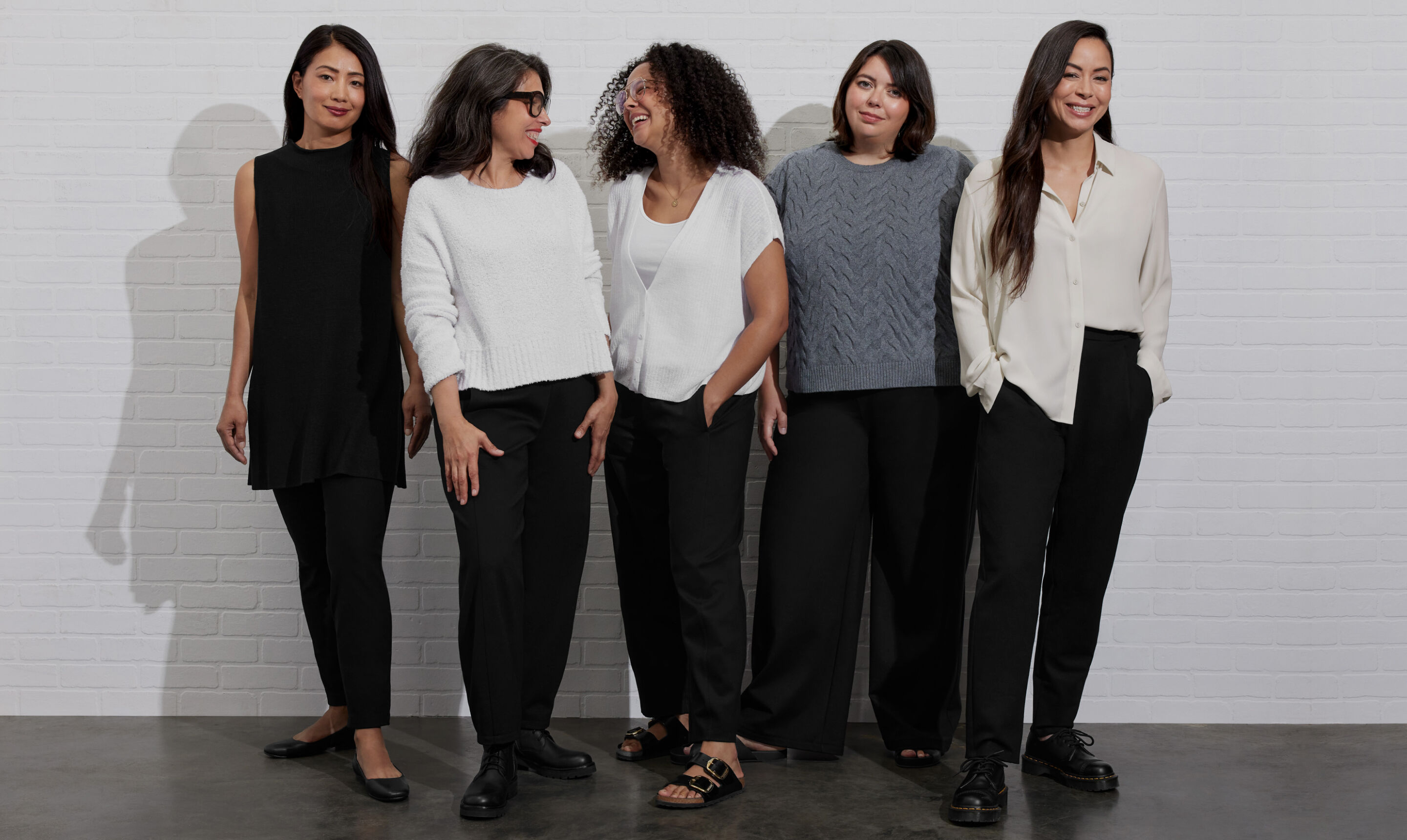 Two women wearing seasonless outfits.