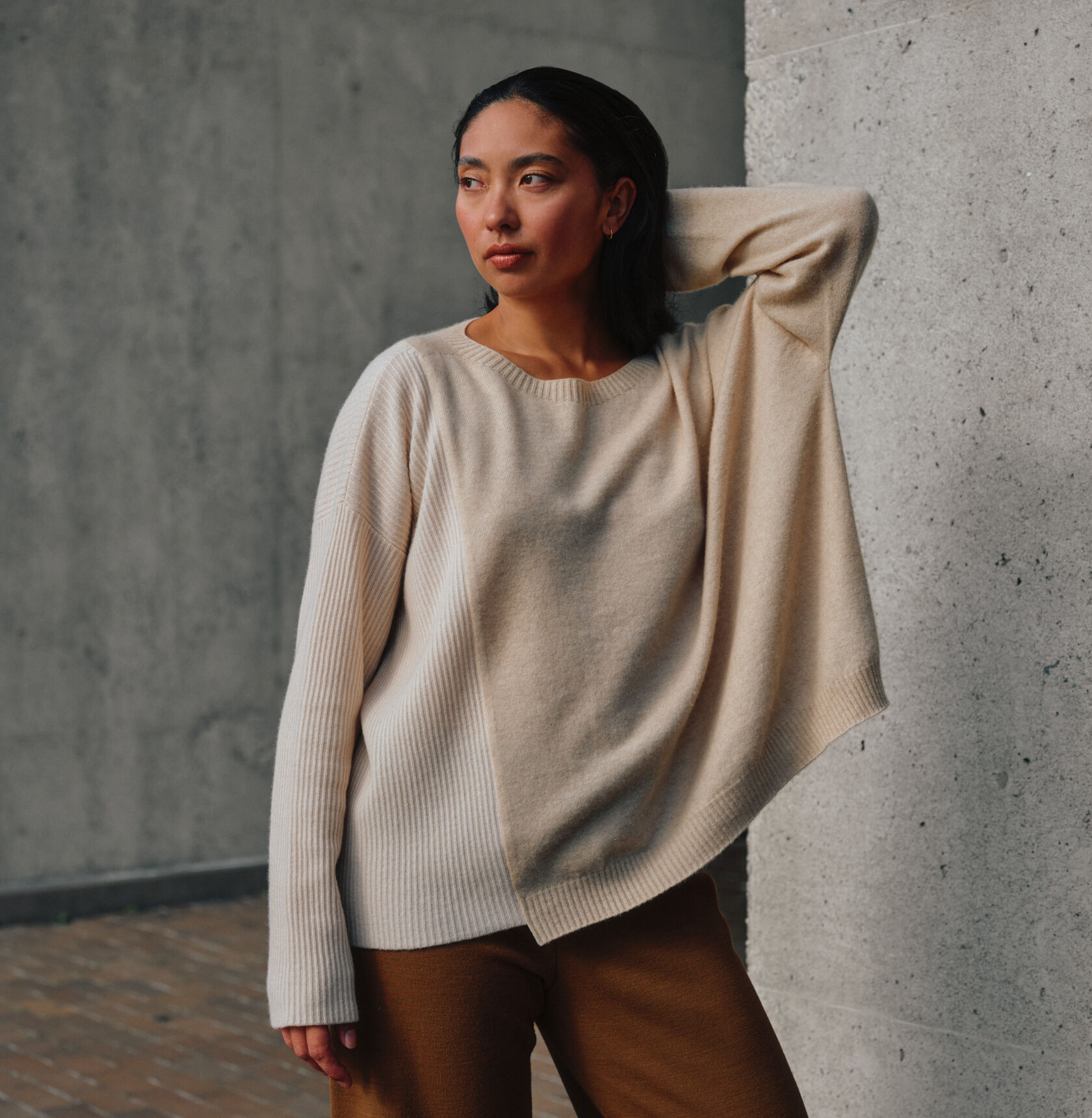 An EILEEN FISHER sweater resewn from damaged clothes.