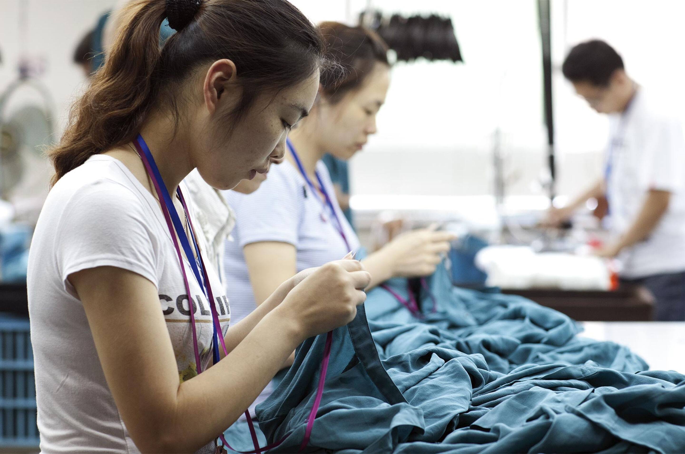 Women sewing at a clothing factory.