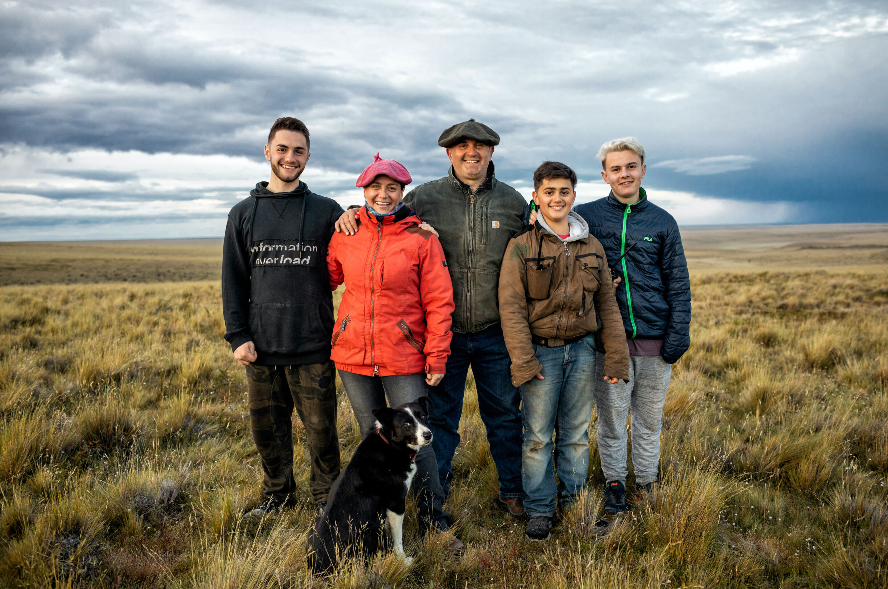 Family of regenerative wool farmers in a field.