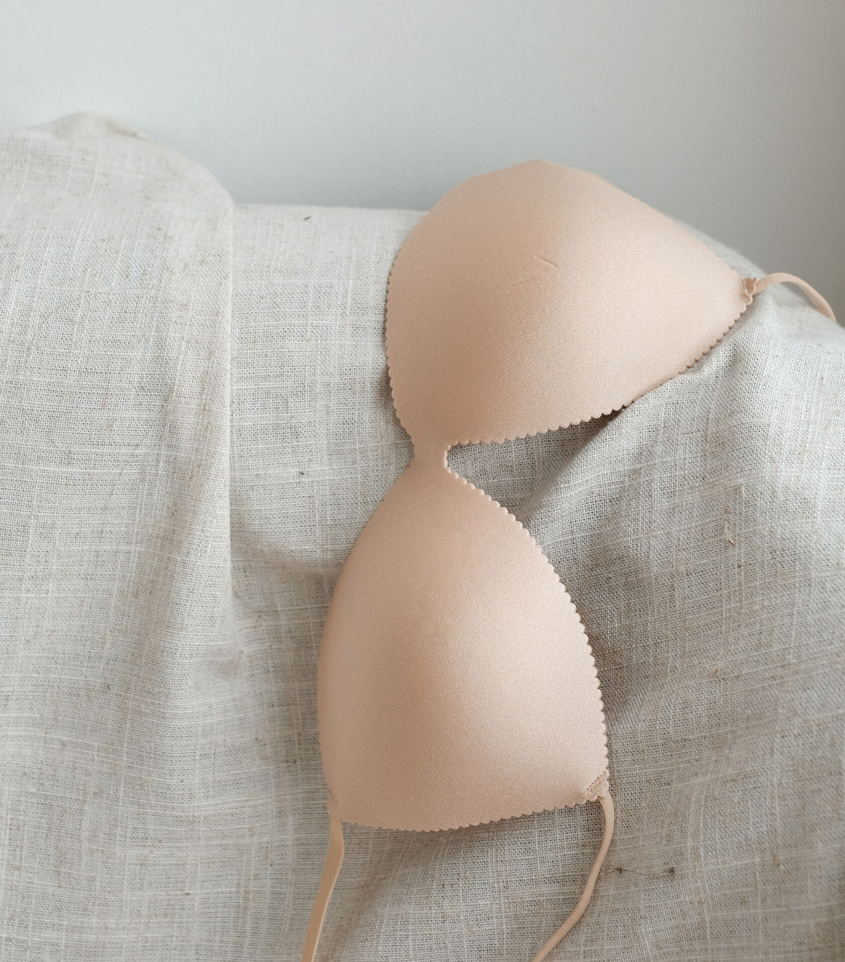 A bra draped over a sofa. A bra draped over a sofa.