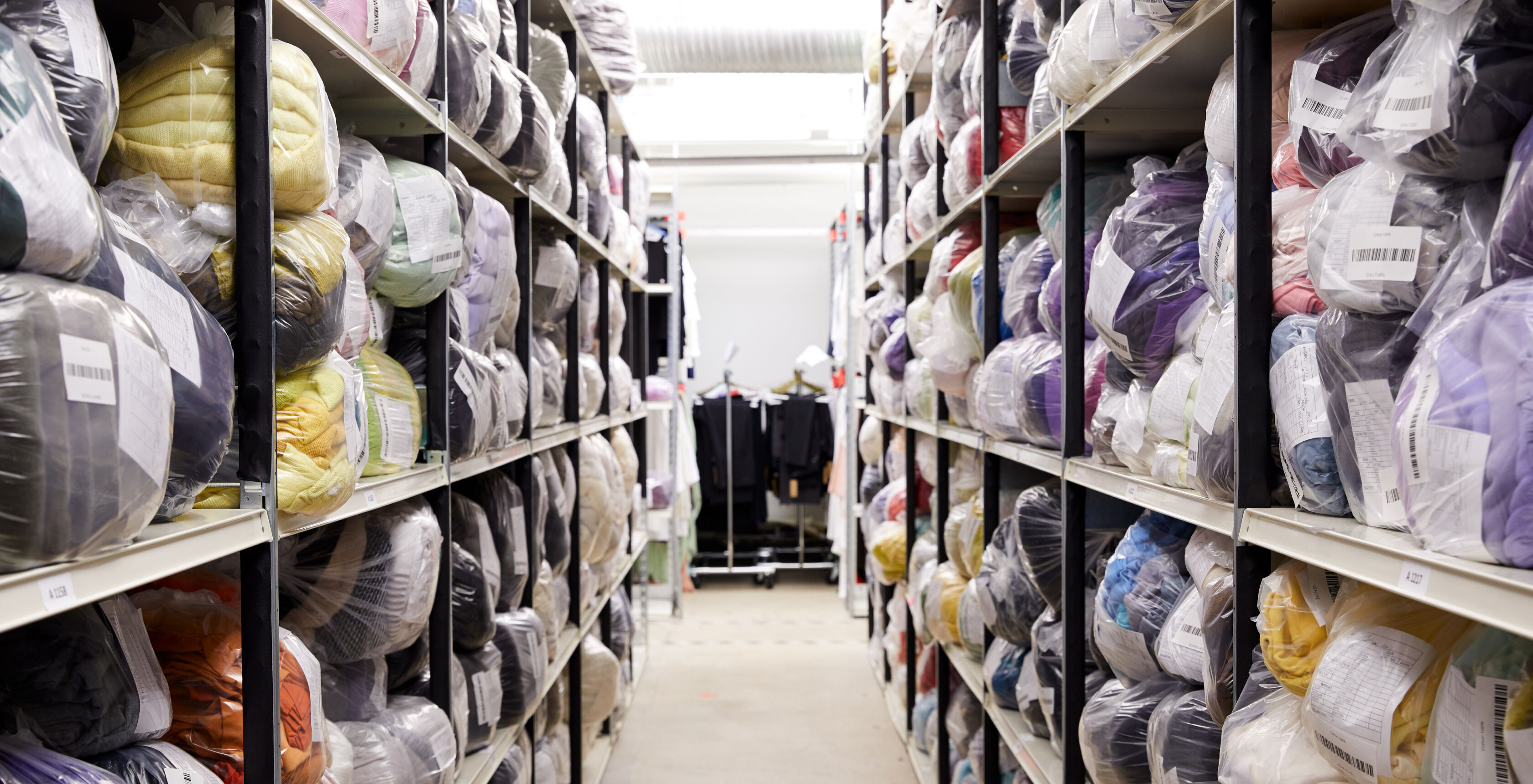 Bags of Clothing at the EILEEN FISHER Tiny Factory. Bags of Clothing at the EILEEN FISHER Tiny Factory.