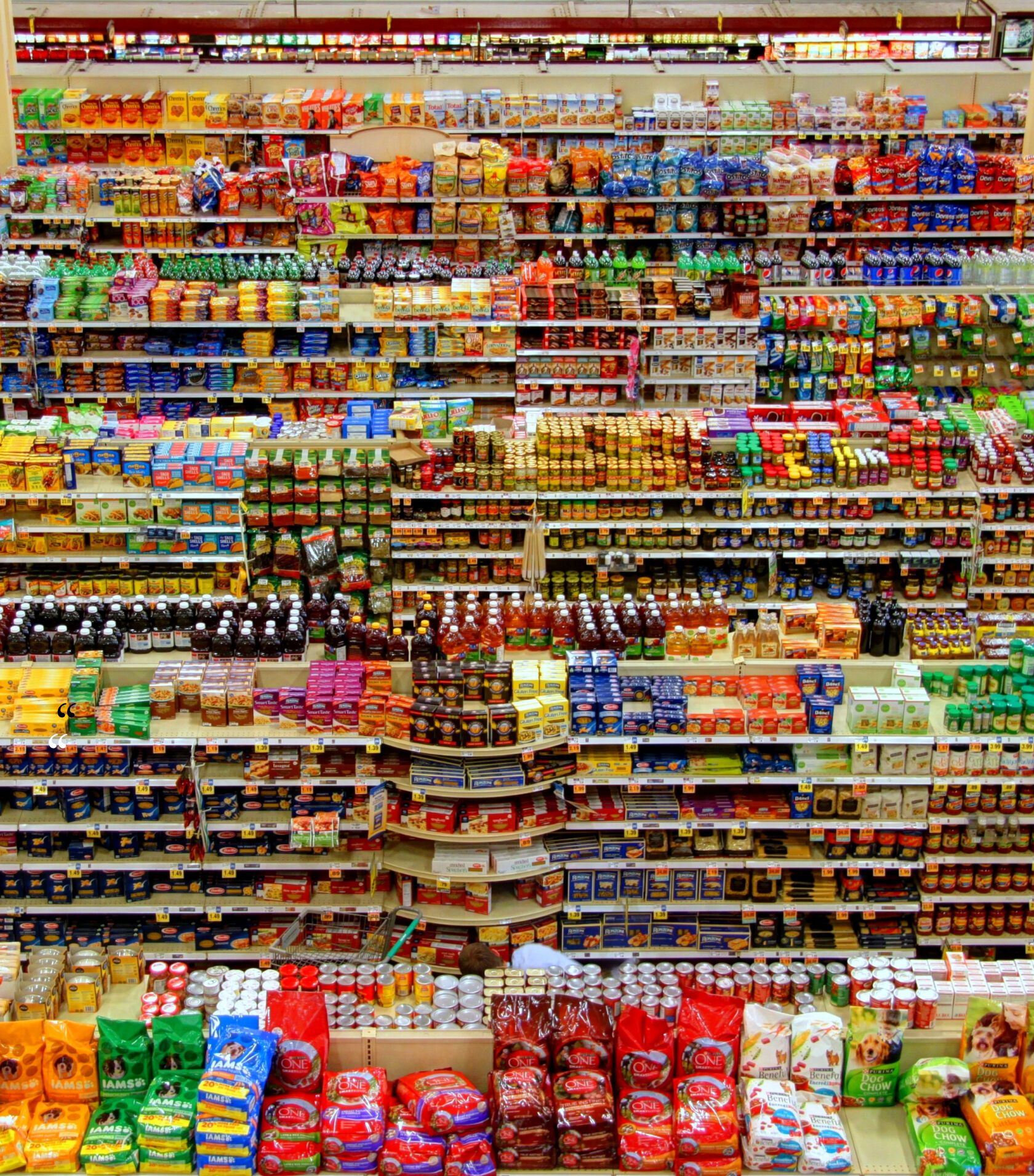 Grocery shelves stocked with packaged goods.