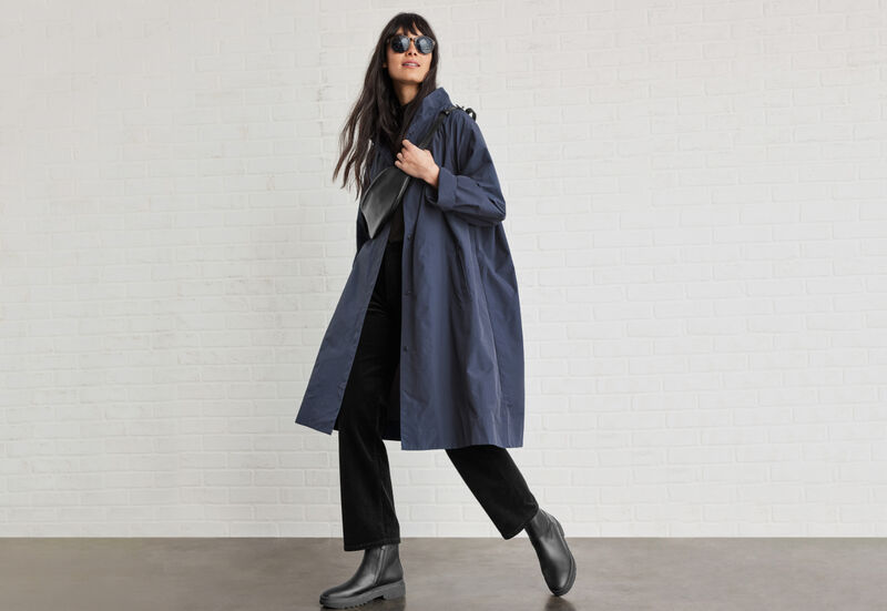 Woman wearing oversized jacket.