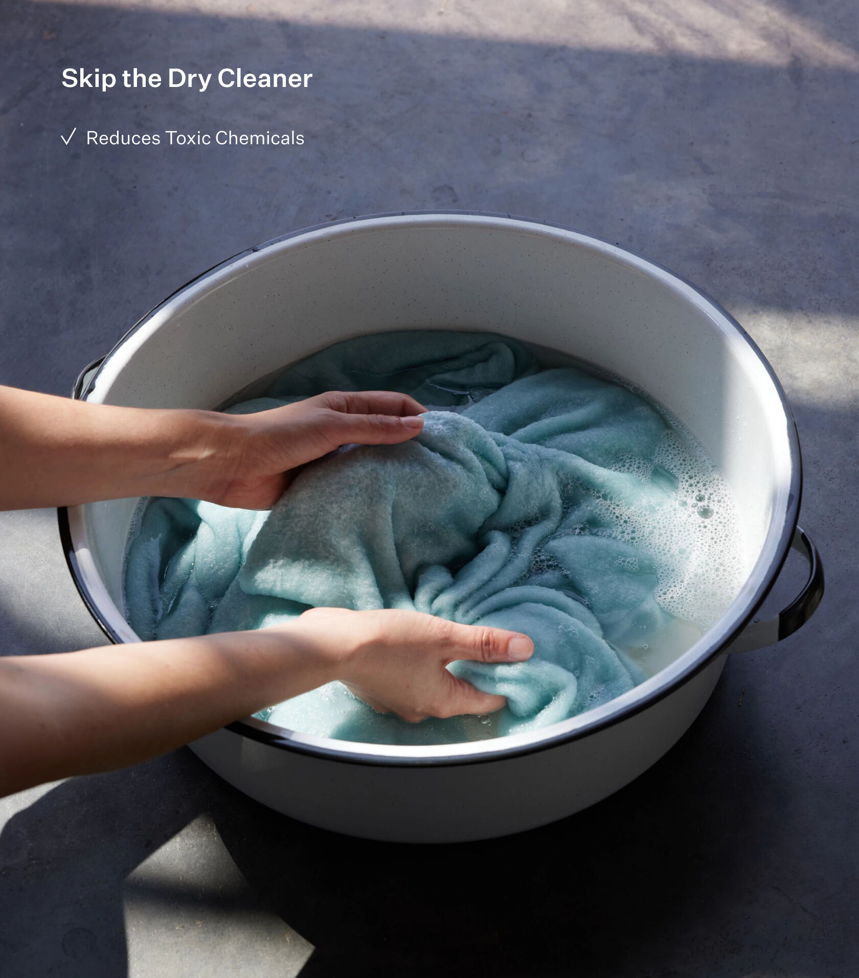 Hand washing a sweater. Hand washing a sweater.
