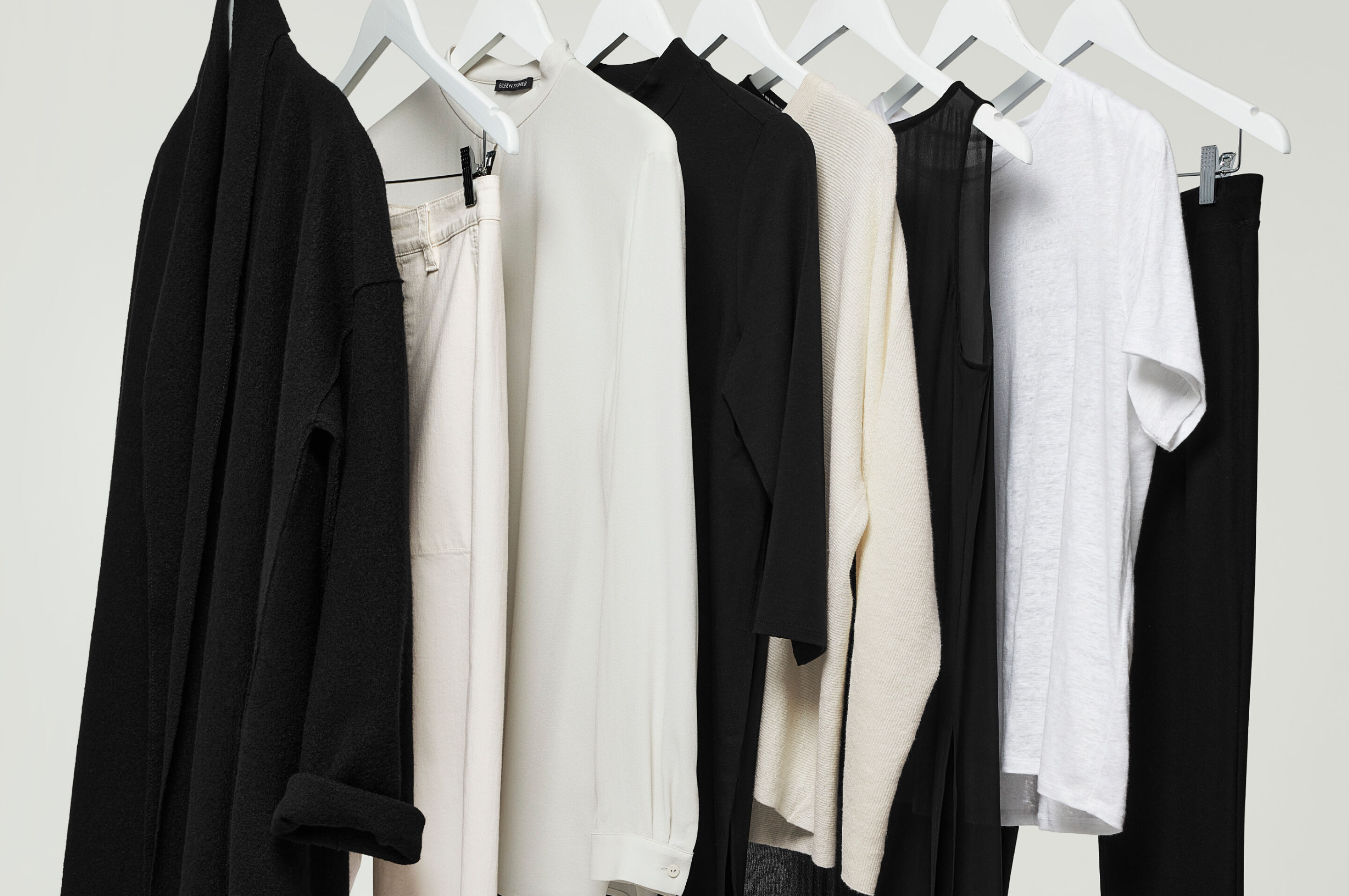 Rack of neutral women's clothing.