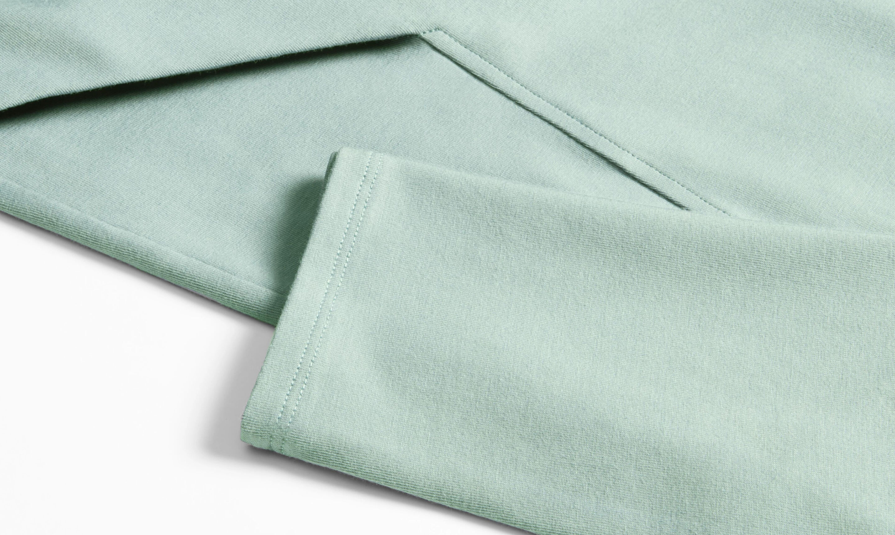 Folded clothing with seam detailing.