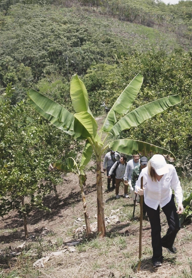 EILEEN FISHER team members climbing a hill in Peru.