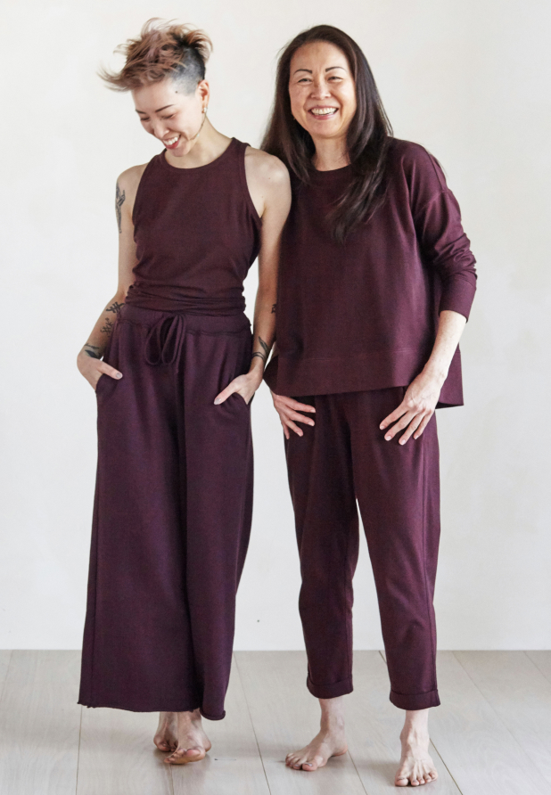 Two women wearing clothing with different proportions.                           
